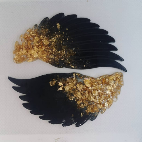 <p>Set of Two Black and Gold Wing Coasters - Art by Lauren Ash</p>